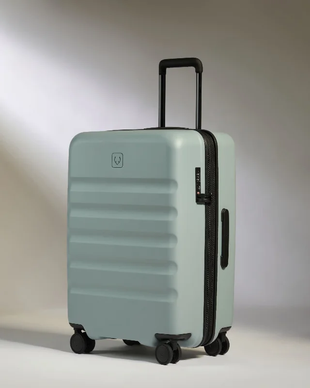 Travel - Size Toiletry Bottles with Leak - Proof Caps in ClearMedium Suitcase in Mist Blue - Icon Stripe